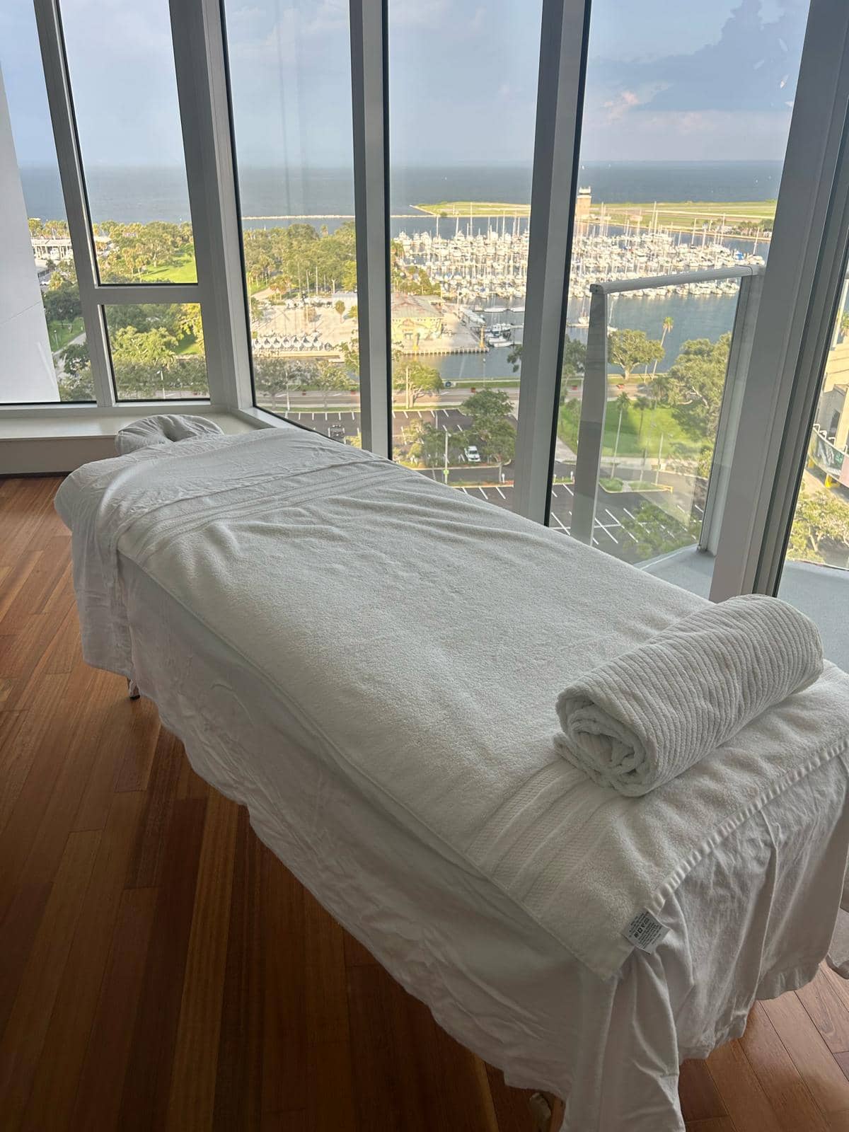 Massage table setup with waterfront view